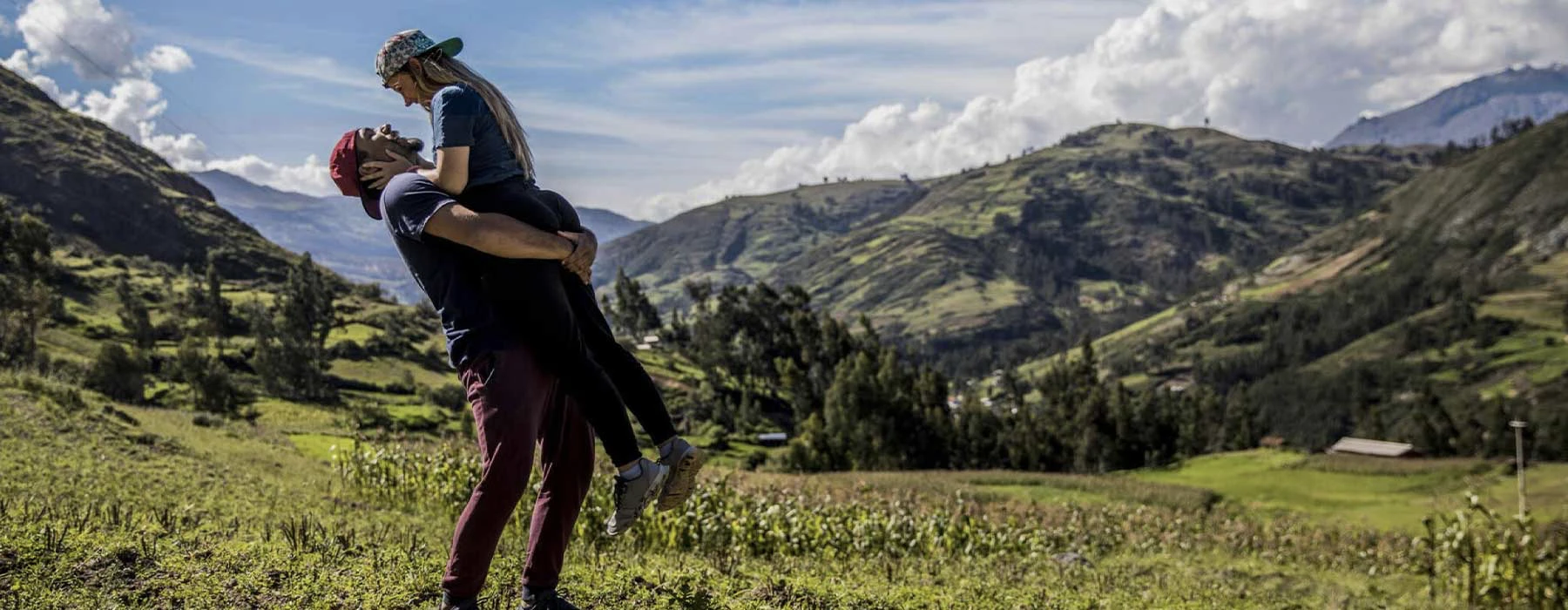 A couple in Sacred Valley in sun day, the man is hold to girlfriend