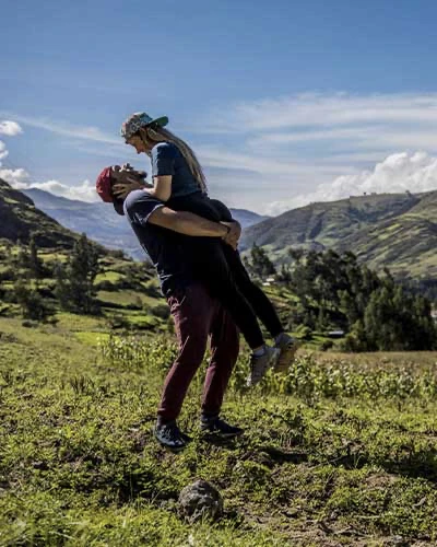 A couple in Sacred Valley in sun day, the man is hold to girlfriend