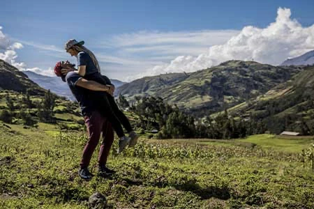 A couple in Sacred Valley in sun day, the man is hold to girlfriend