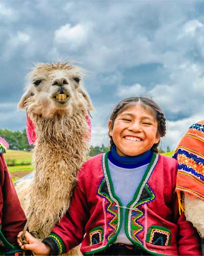 Andean Childs with Llama in Peru